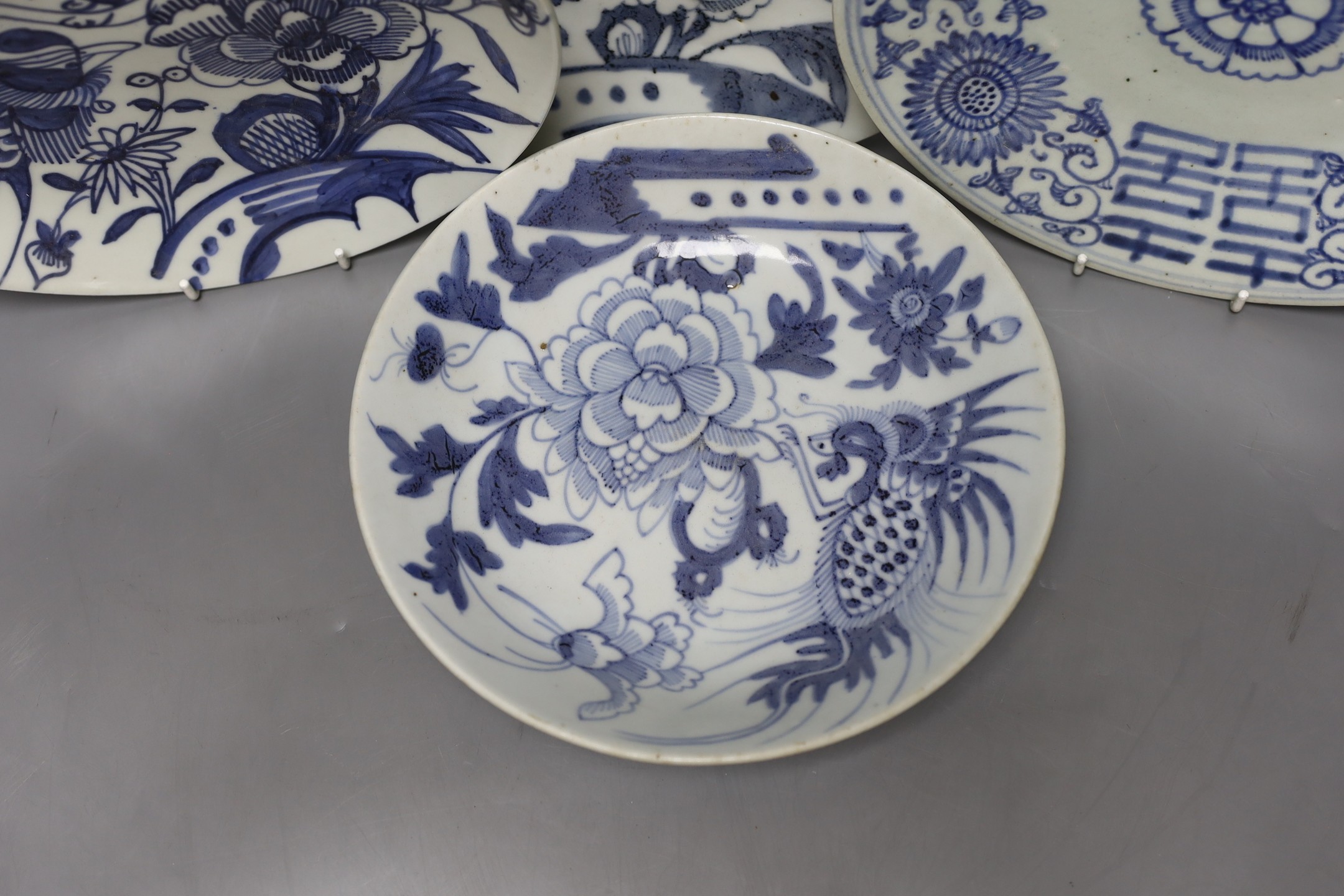 Four blue and white Chinese saucer dishes, 19th / 20thcentury, largest 25cm diameter